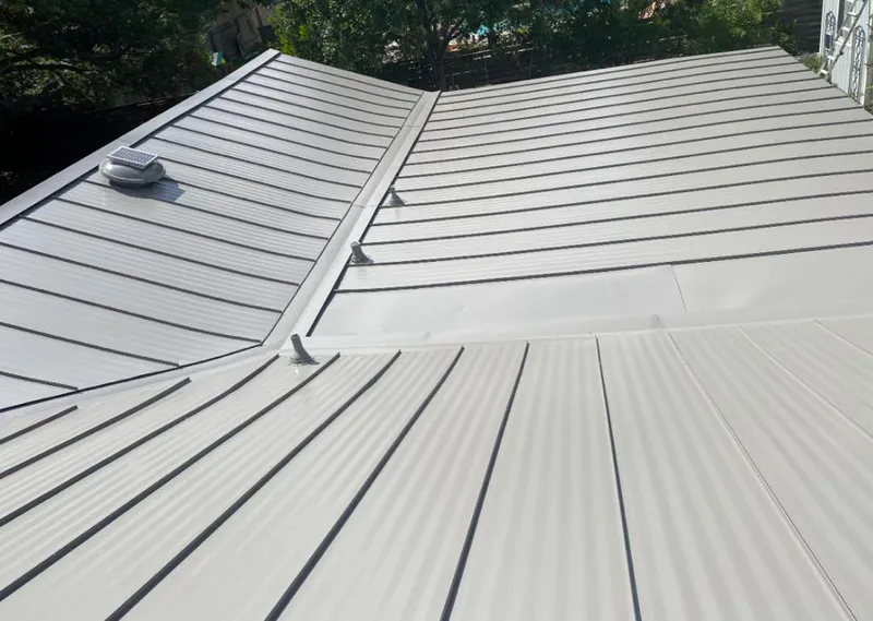 Solar attic fan installed on a metal roof for Roof Ventilation in Rockport